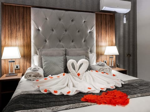 Desk, laptop workspace, blackout drapes, iron/ironing board