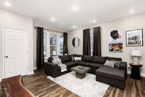 Spacious TV/family room with sectional seating.