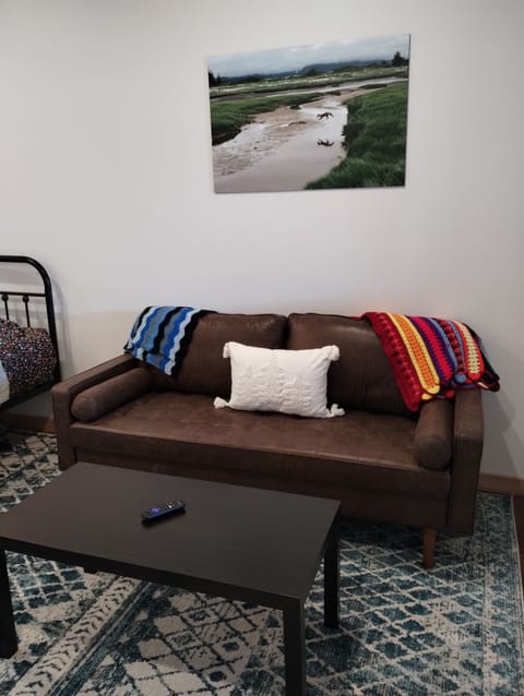 Leisure Suite. Equipped with two queen beds, kitchenette, sofa, 32 inch smart TV, and, dining area.