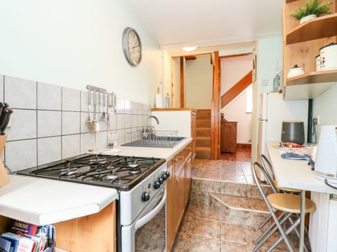 Fridge, electric kettle, toaster, cookware/dishes/utensils