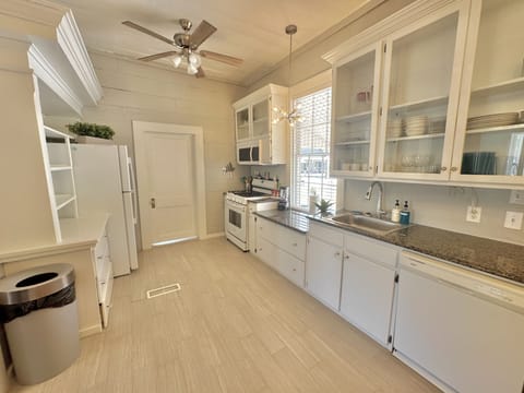 Spacious kitchen area, plenty of cookware, and dinner ware provided!