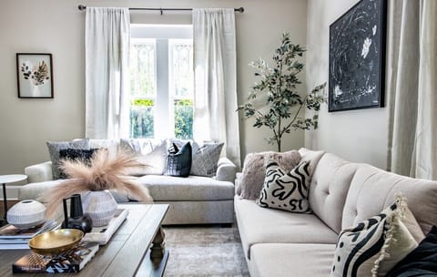 Gorgeous comfortable living room with plenty of seating to cozy up!