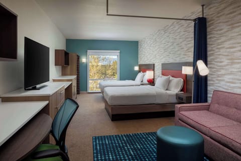 Studio Suite, 2 Queen Beds | Living area | 55-inch flat-screen TV with satellite channels