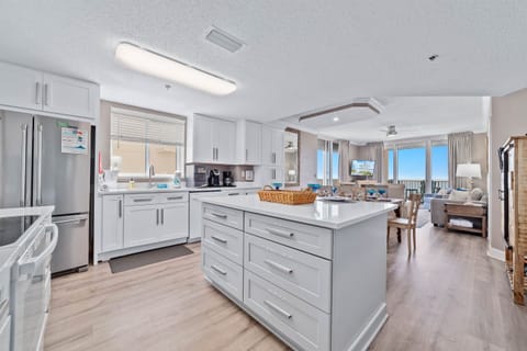 The kitchen takes center stage, offering ample counter space and casual seating. Perfect for meal prep, entertaining and catching up on the day's activities.