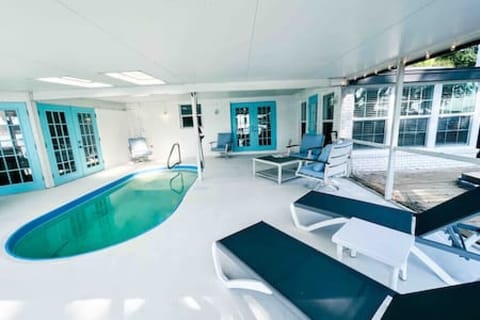 Completely Covered Swimming Pool w/ Lounging Chairs