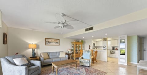 Spacious living area with soft lighting, perfect for unwinding.