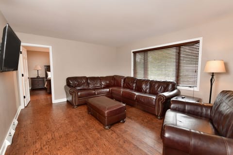 Desk, iron/ironing board, bed sheets