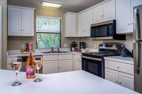 Kitchen equipped with New Stainless Steel Appliances ~ Refrigerator, Electric Oven & Cooktop, Dishwasher, Microwave, Keurig & Coffee Maker, Blender &