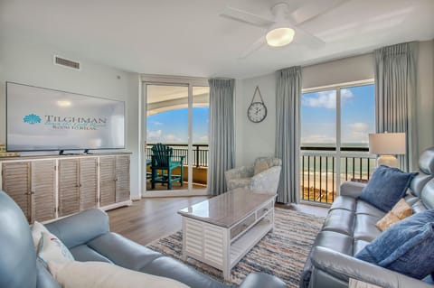 Sink into leather seating while enjoying ocean views through floor-to-ceiling windows. Your coastal retreat awaits with modern comfort.