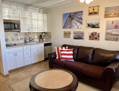 Queen-sized pullout couch, coffee table with 4 stools