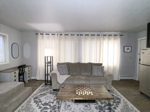 Main living room with a view to the South.  Open the window's for more day light