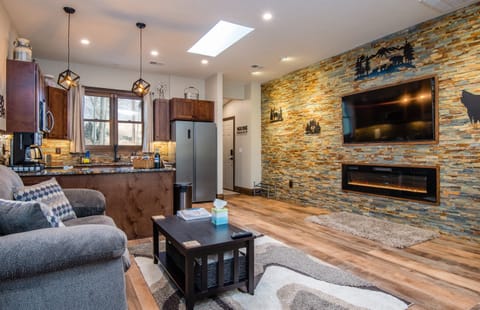 The Mountain Modern unit has a large living area with a gas fireplace