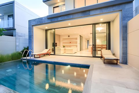 A view of Villa's exterior from the backyard, with a vista of BRG golf course. 