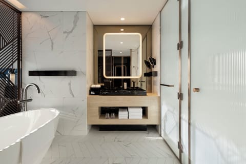 Separate tub and shower, rainfall showerhead, free toiletries