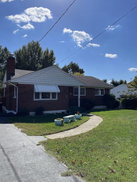 The driveway holds multiple cars and has an easy walkway to the front door. 