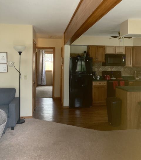 Walking in the front door opening to kitchen, dining area and living room.