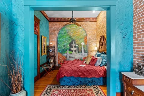 Bedroom with hand painted mural