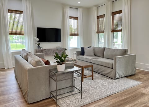 High ceilings and large windows let in lots of light in the living room.