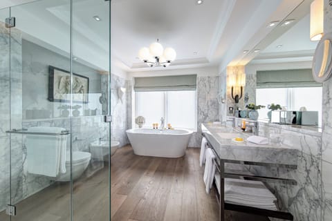 Shower, designer toiletries, hair dryer, bathrobes