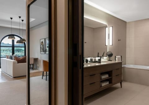 Junior Studio Suite | Bathroom | Hair dryer, slippers, towels, soap