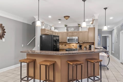 Kitchen with bar stools for additional seating