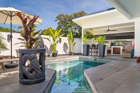 Private pool, outdoor kitchen, and seating. 