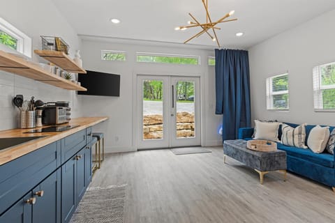 Kitchenette and living room with beautiful wooded views.