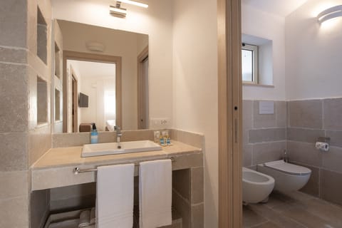 Shower, bidet, towels, soap