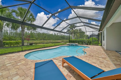 Villa Paradise at The Preserve - The screened in pool area offers lake and preserve view