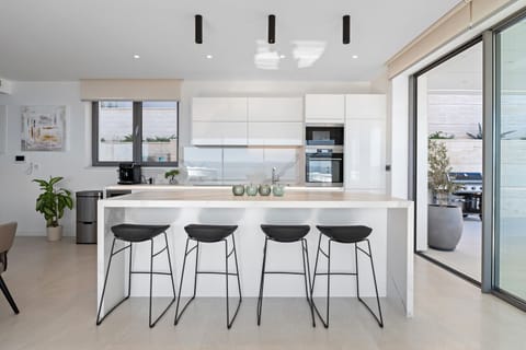 A fully equipped kitchen with all the needed amenities a modern guest needs for a comfortable stay