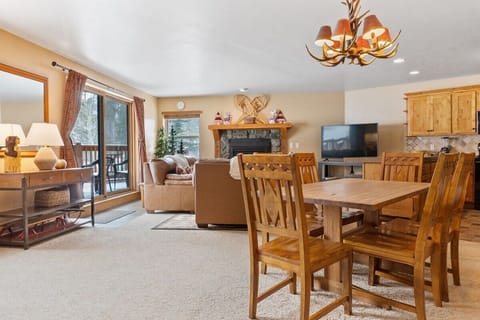 The view over the open dining room and living room. The open and social layout of the condo makes it easy to stay connected with loved ones.