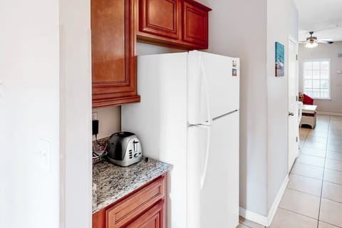 Full-size fridge and microwave in spacious kitchen