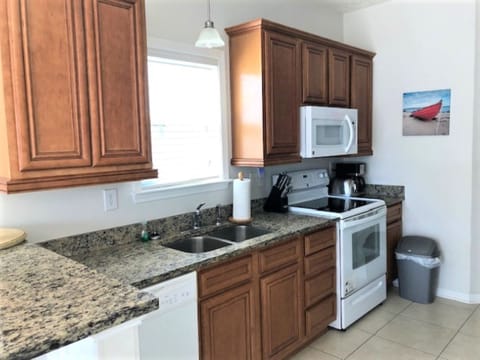 Kitchen area with stainless appliances and granite countertops