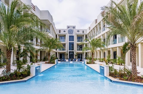 Resplendent Pool in Noord Aruba near Palm Beach - Relax by the shimmering poolside oasis - Crystal Clear Water - Plants and Trees introduce freshness and visual interest