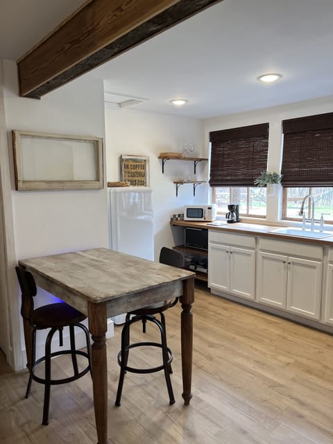 Nice clean kitchen. 
Table to dine at or work at.