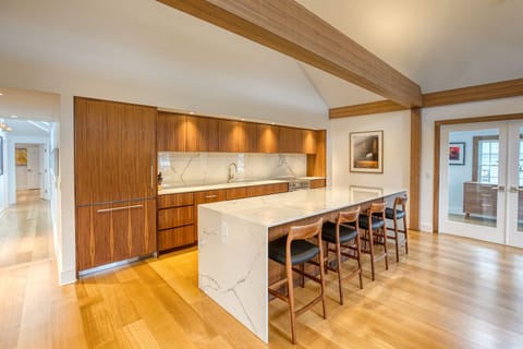 Chef's kitchen with custom walnut cabinets
