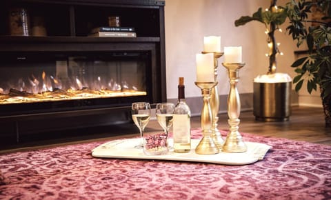 Turn up the romance — or the chill. Our color-changing fireplace anchors the whole living space.