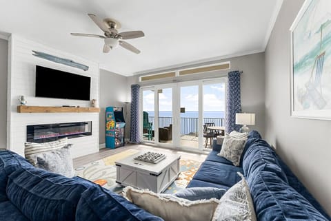 Living room with flat screen TV, arcade game and beautiful view