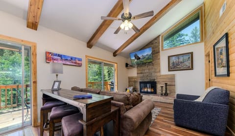 Cozy living room with comfy couch and fireplace.