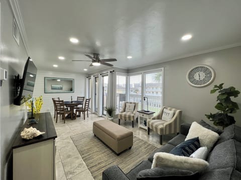 Relax in your modern living space with comfortable seating, natural light, and thoughtful decor creating the perfect home away from home.
