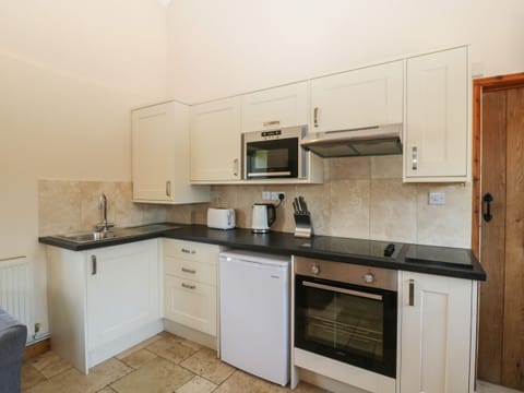 Fridge, electric kettle, toaster, cookware/dishes/utensils