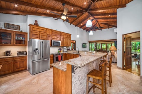 Fully equipped kitchen and bar counter.