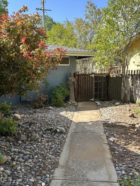 Front access (to the right side of the main house) to get to the rental gate.