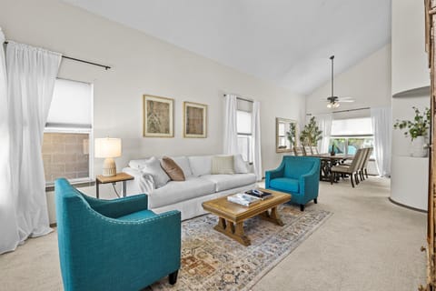 French country seating area with queen sleeper sofa- and gorgeous dining room!