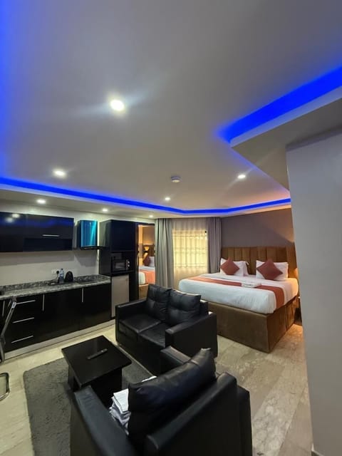 Luxury Studio Suite | Living area | 43-inch Smart TV with cable channels, TV, Netflix