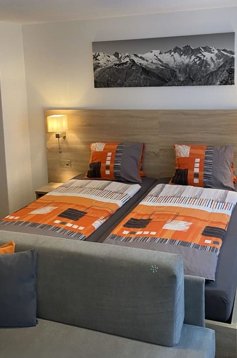 Furniture, Comfort, Building, Wood, Bed Frame, Textile, Orange, Pillow, Architecture, Interior Design