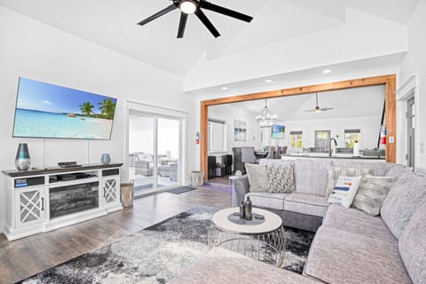 The lake view living room connects with the dining and front living room with the open laout of the home.