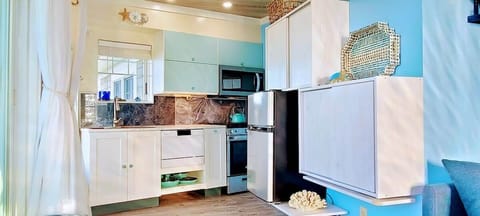Bright, charming and fully functional. Create your own magic in this kitchen by the lake.