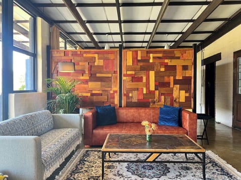 Comfortable seating and lots of natural light with stacking doors that open the apartment up onto the balcony area.