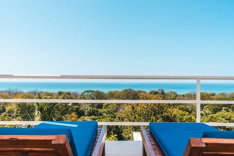  & ocean-view balcony with private lounge seating. 